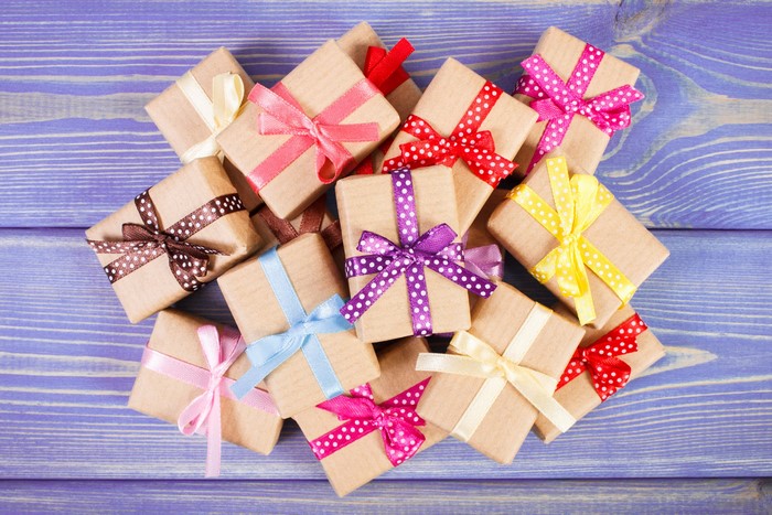 Many gift boxes with colorful bows