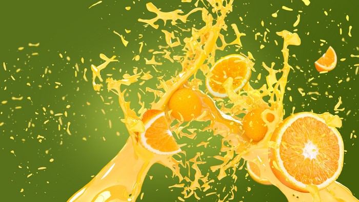 Orange fruit juice splash with slices