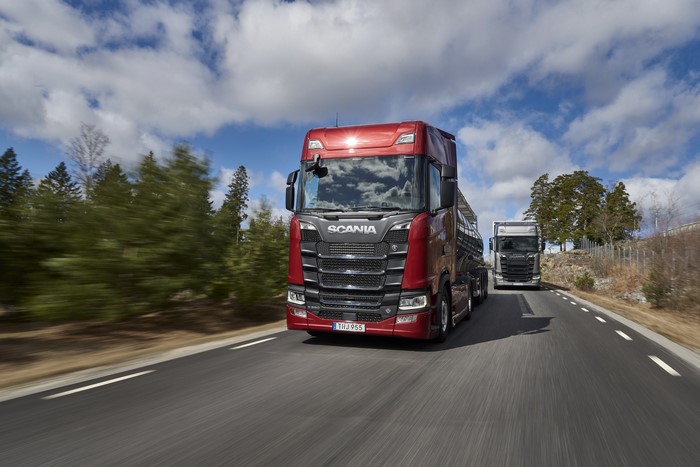 Two Scania S 650 trucks driving on a road