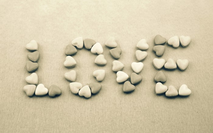 Love spelled with heart-shaped candies
