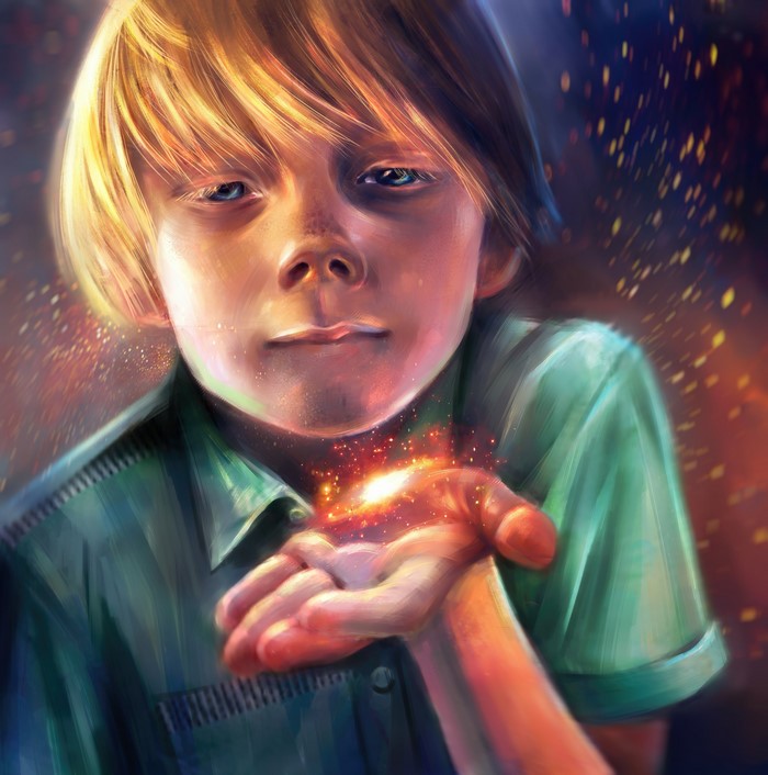 Boy with magic sparks in his hand