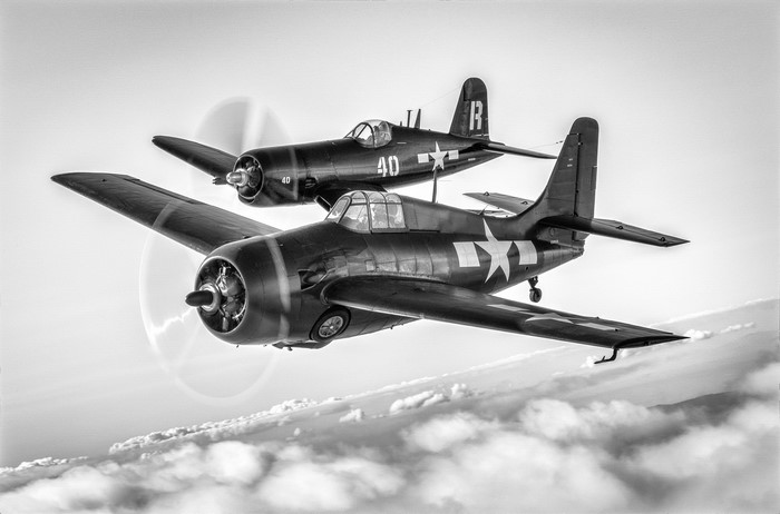 Two Grumman FM-2 Wildcat fighter planes in flight