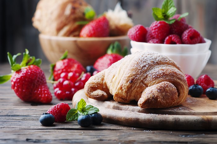 Croissant with raspberries and strawberries
