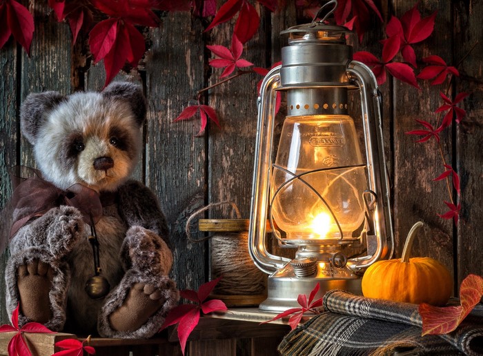 Teddy bear with kerosene lamp and pumpkin