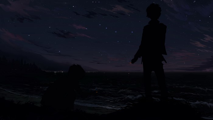 Two boys silhouetted by the sea at night