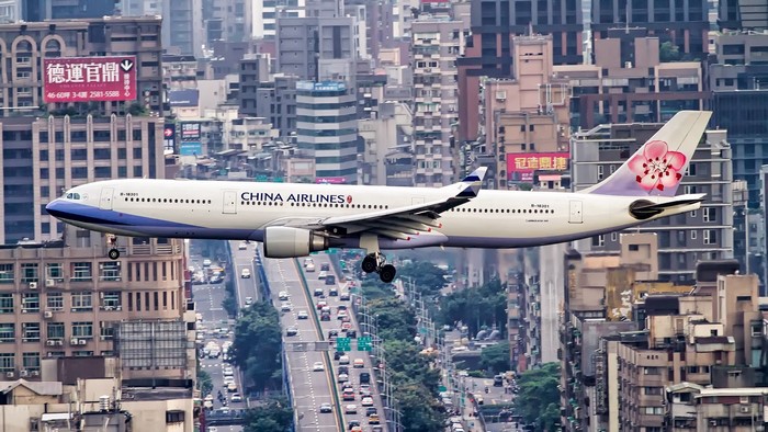 China Airlines Airbus A330-300 landing over city