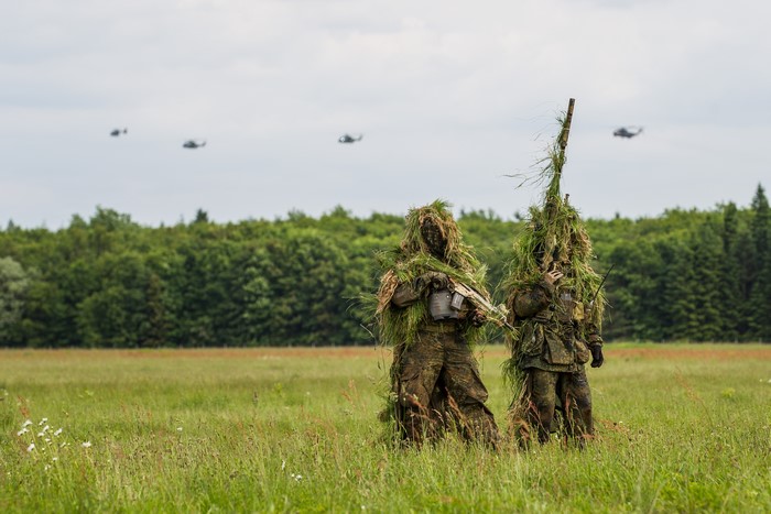 Bundeswehr soldiers in ghillie suits in a field