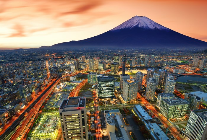 Mount Fuji over Yokohama cityscape at dusk