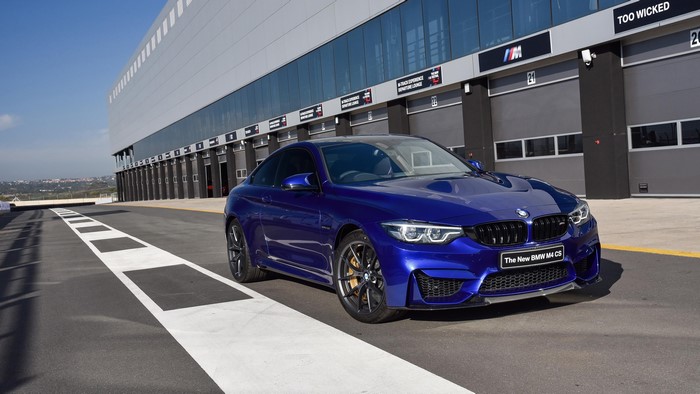 Blue BMW M4 CS on a Race Track