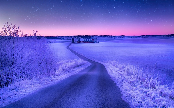 Winter landscape with a road and a house