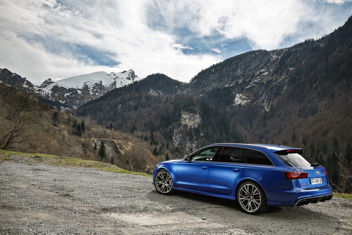 Blue Audi RS 6 Estate car in mountains