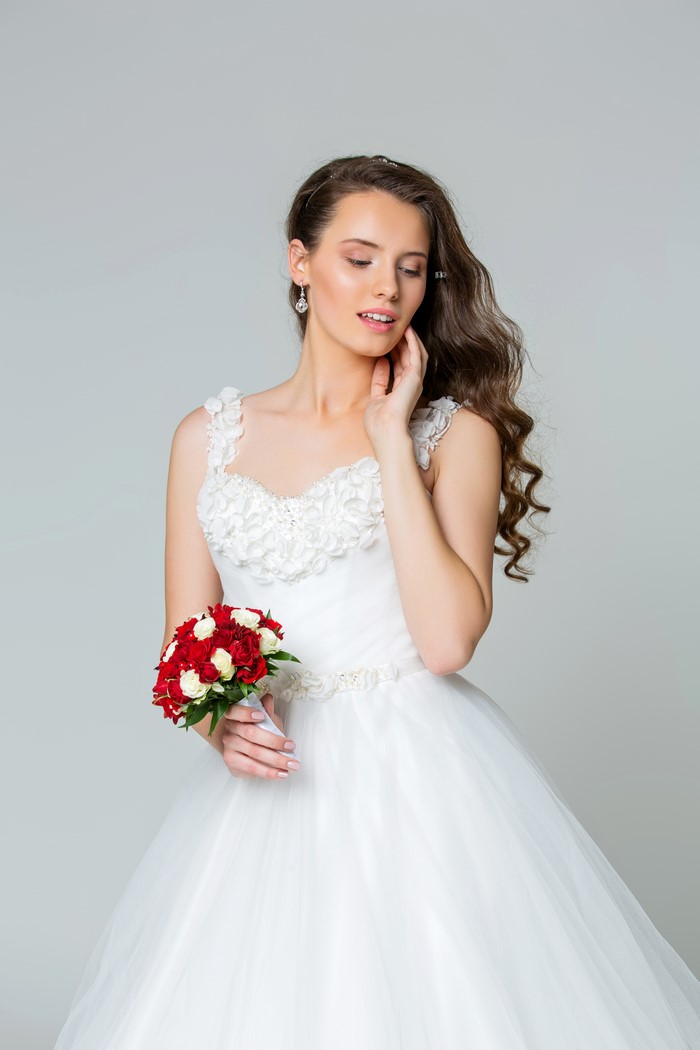 Bride in a white dress holding a bouquet