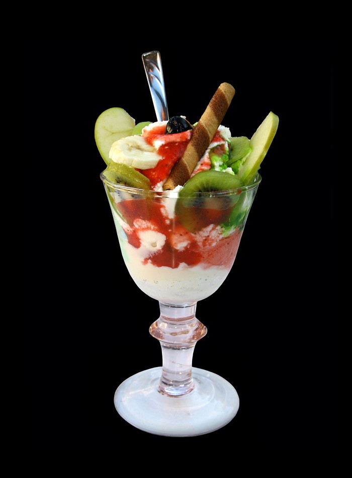 Ice cream sundae with fruit and wafer stick