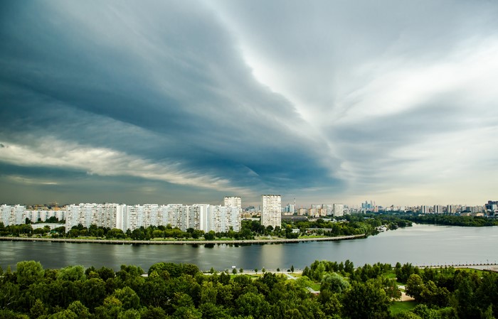 Moscow cityscape with river and stormy sky