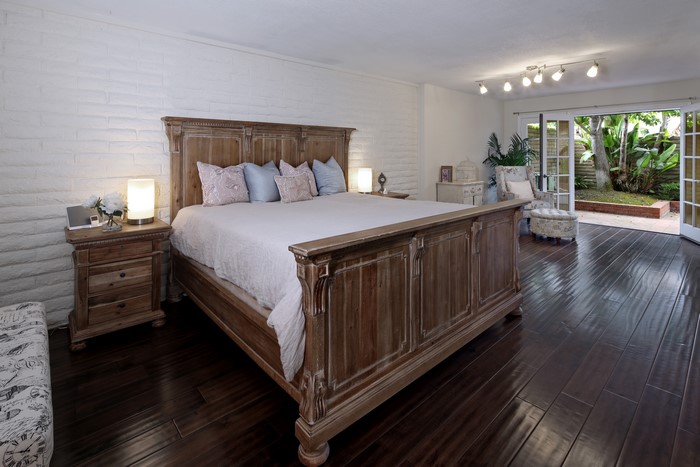 Bedroom with king-size bed and patio doors