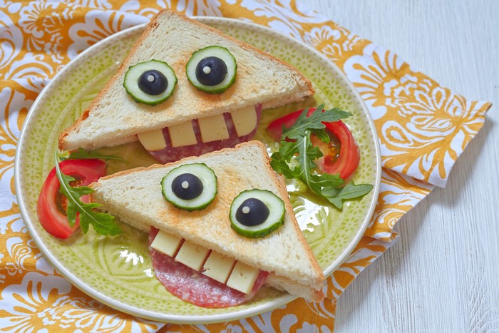Two monster sandwiches on a plate