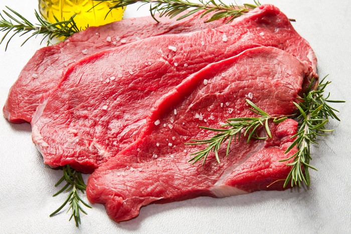 Raw Beef Steaks with Rosemary and Olive Oil