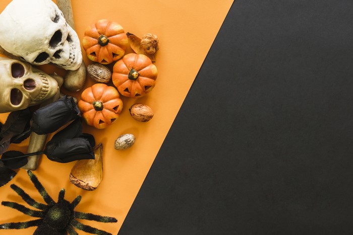 Halloween skulls, pumpkins, spider, and black roses
