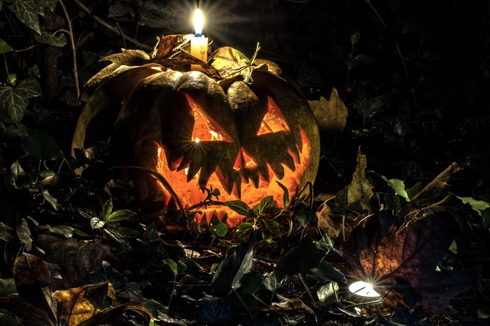 4K Halloween carved pumpkin with candle