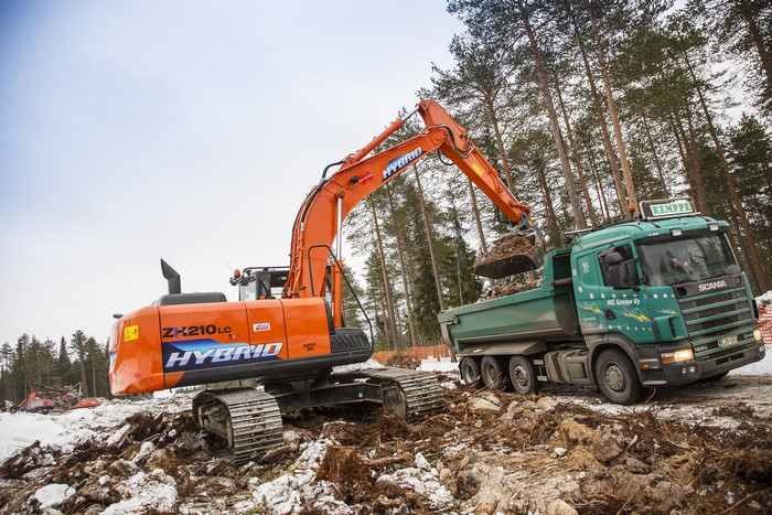 Hitachi ZH210LC-5 hybrid excavator loading a Scania truck