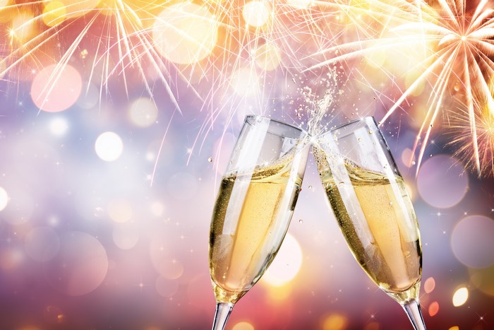 Champagne Glasses and Fireworks