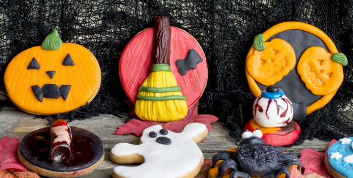 Halloween cookies with pumpkins, broom, ghost, spider, and eye
