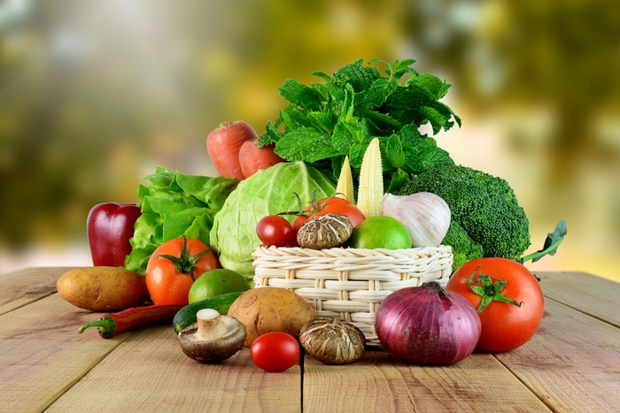 Assortment of Fresh Vegetables and Mushrooms in Wicker Basket