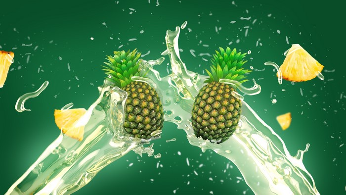 Pineapples splashing in water