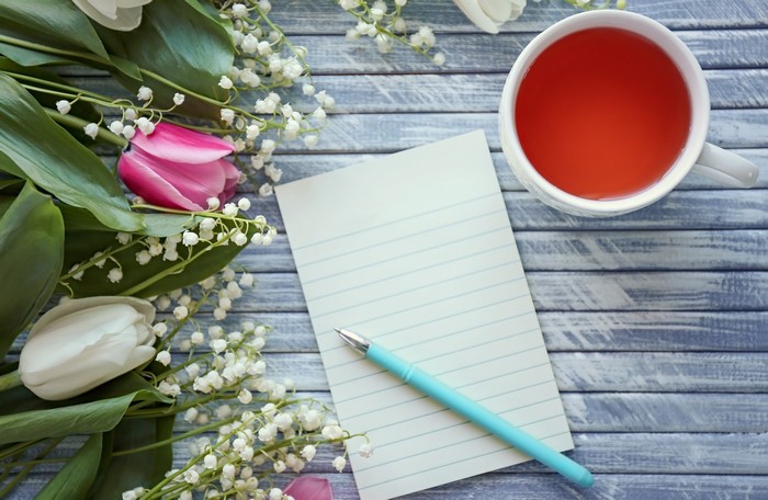 Tulips, Lilies of the Valley, Tea, and Paper on Wood
