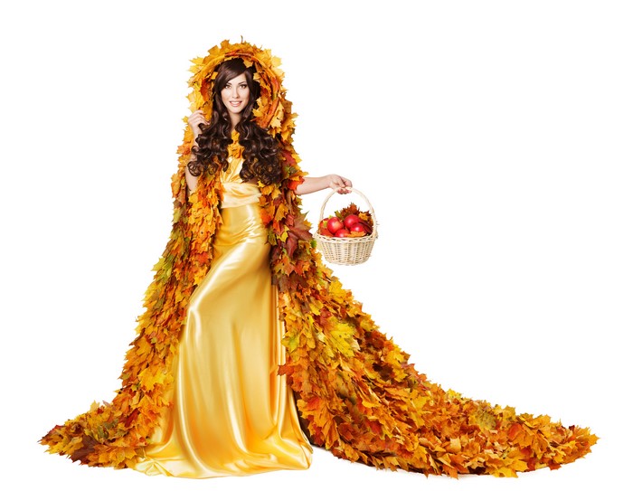 Woman in Autumn Leaf Dress Holding Basket of Apples
