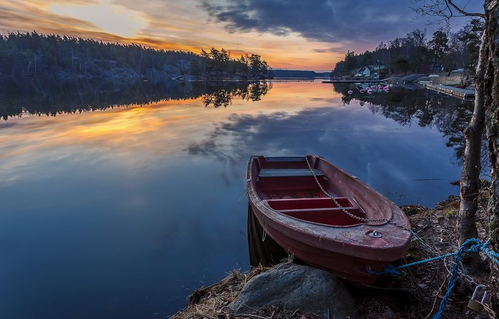 Boat on a lake at sunset in Sweden