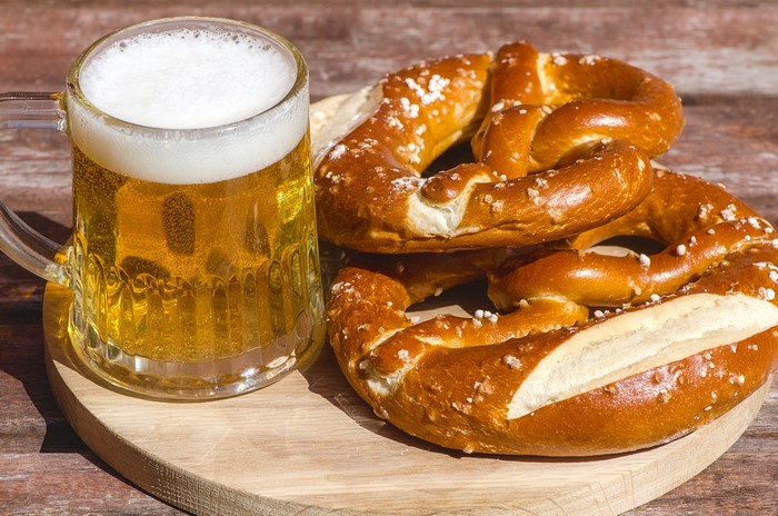 Beer in a mug with pretzels