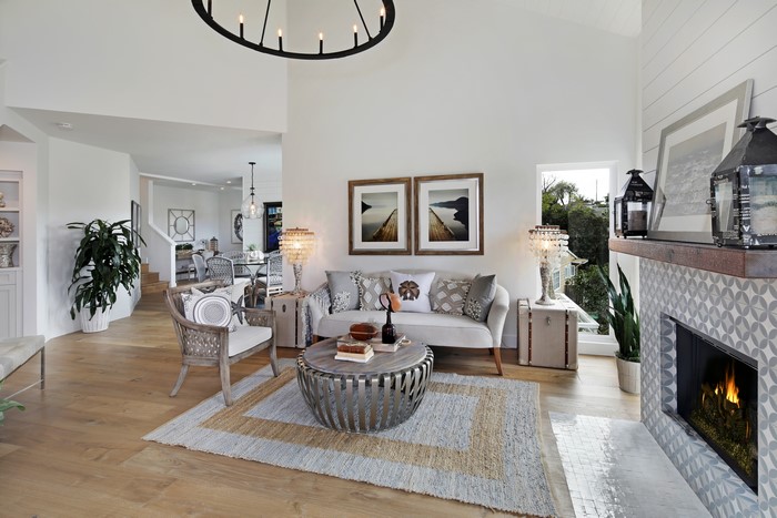 Living room with sofa, armchair, and fireplace