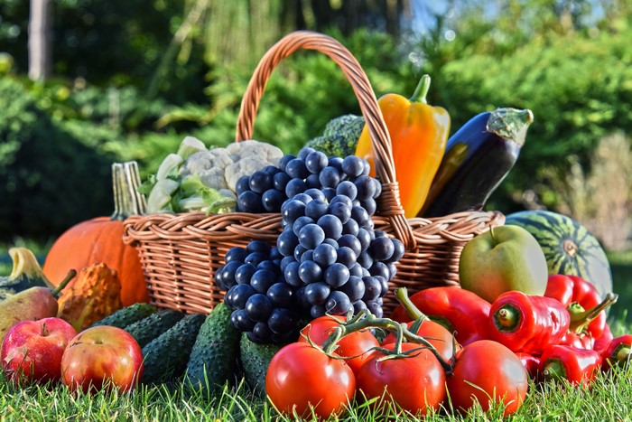 Harvest of Vegetables and Fruits in a Wicker Basket