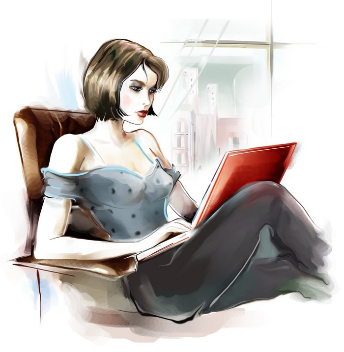 Woman with brown hair using a laptop while sitting