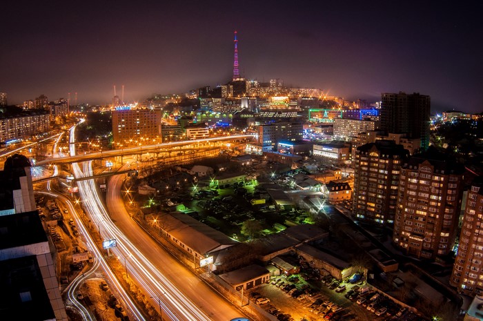 Night view of Vladivostok, Russia with illuminated roads and buildings