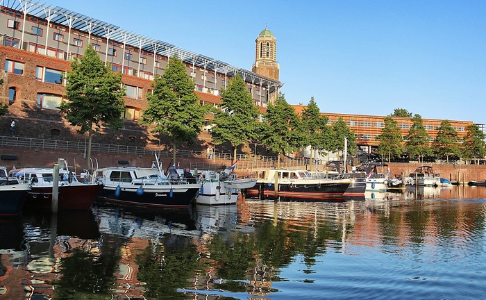 Boats docked in a canal in Zwolle, Netherlands