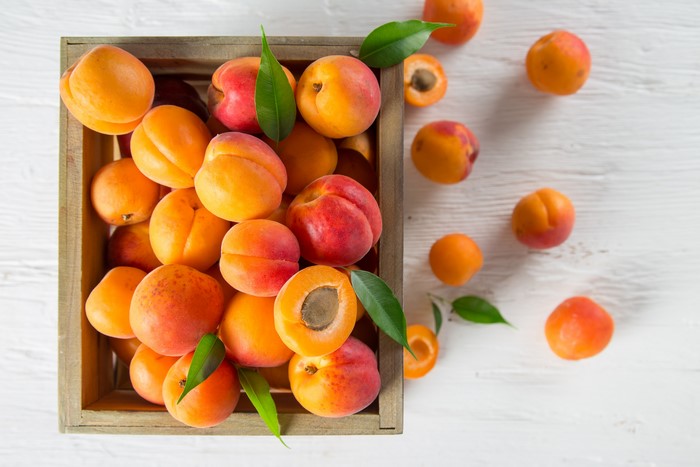 Apricots in a wooden crate
