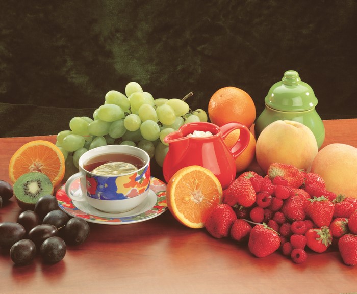 Still-life with Tea, Grapes, Strawberries, Raspberries, Oranges, and Peaches