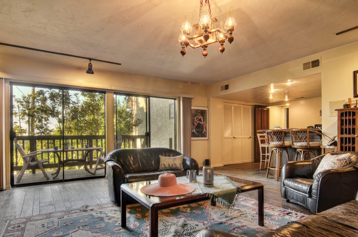 Living room with chandelier and armchair