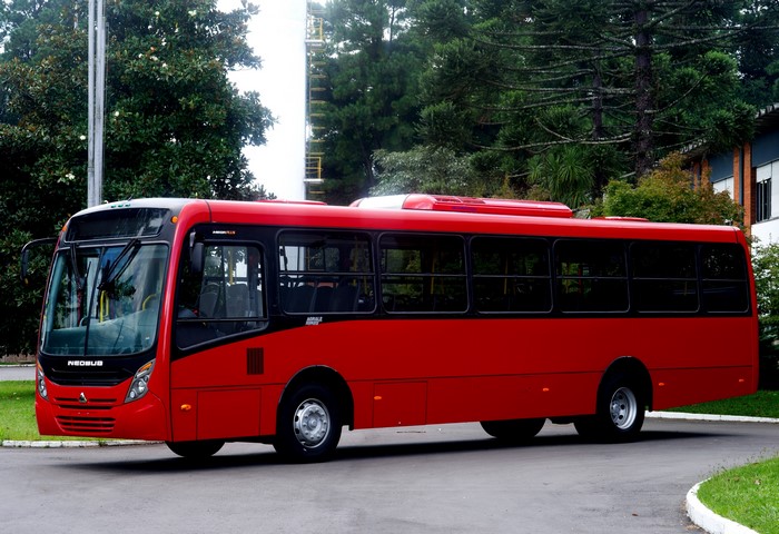 Red Neobus Mega Plus Bus on Paved Road
