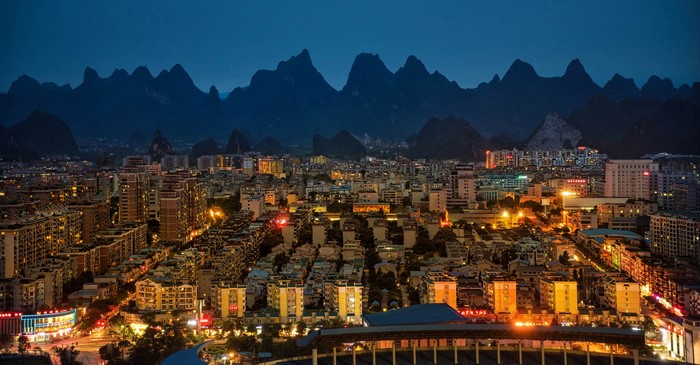 Yangshuo, China at night with mountains