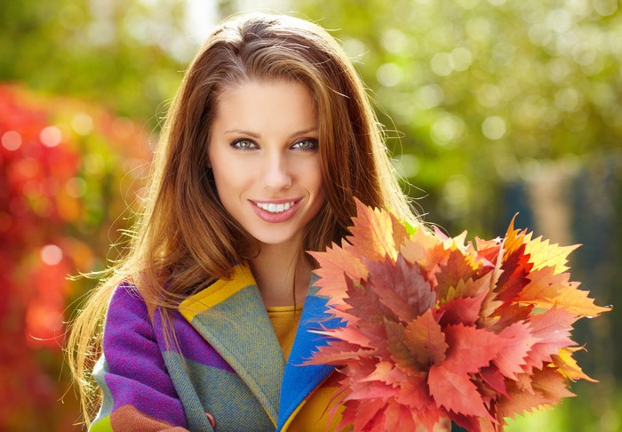 Woman with Autumn Leaves