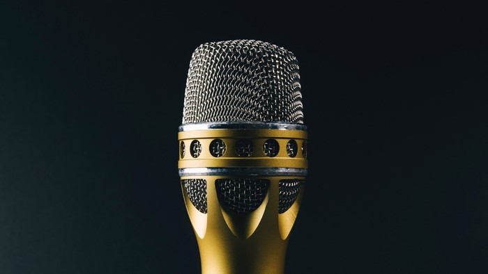 4K Closeup of a Gold Microphone