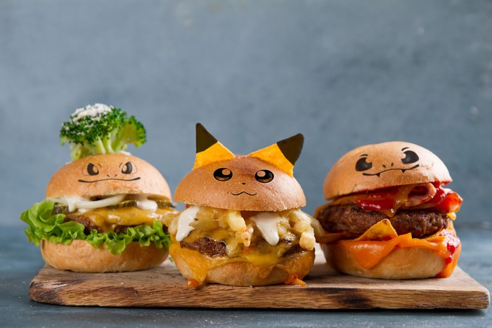 Three Pokemon-themed burgers on a cutting board