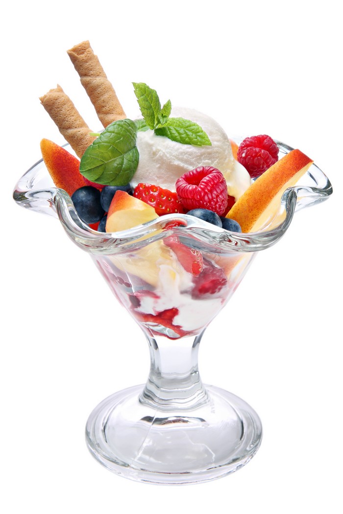 Ice cream sundae with berries and wafer sticks