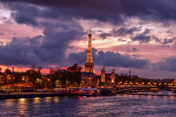 Eiffel Tower at sunset over the Seine River in Paris
