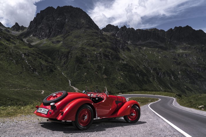 Red BMW 328 Roadster on a mountain road