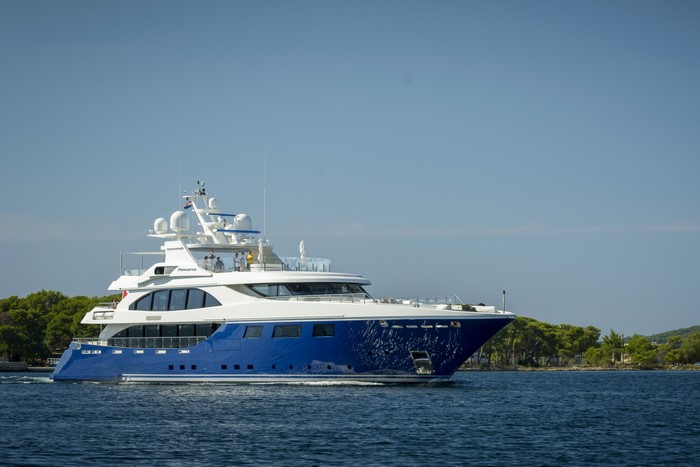 Blue and white yacht sailing on the water