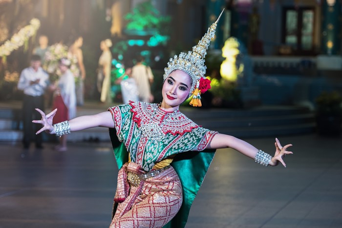 Thai dancer in traditional costume performing